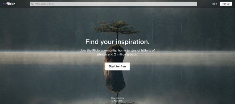 A solitary tree on a misty water body, featured on the Flickr homepage as one of the best sites for free images, with an invitation to find inspiration.